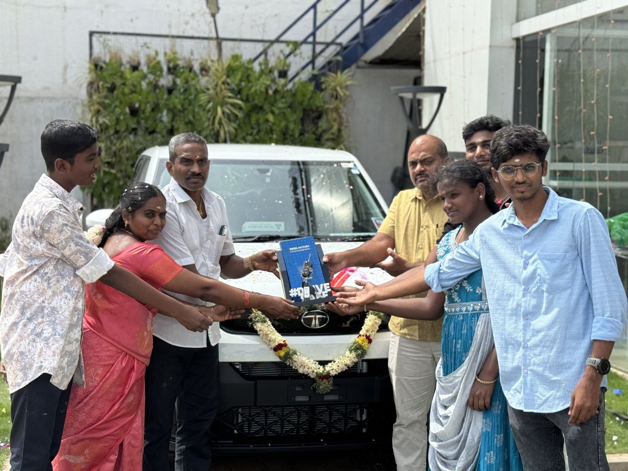Family celebrating a new car